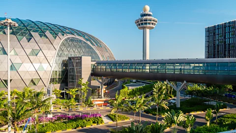 Getty Images Singapore Changi Airport's Jewel complex and control tower rise above landscaped gardens and an elevated walkway (Credit: Getty Images)